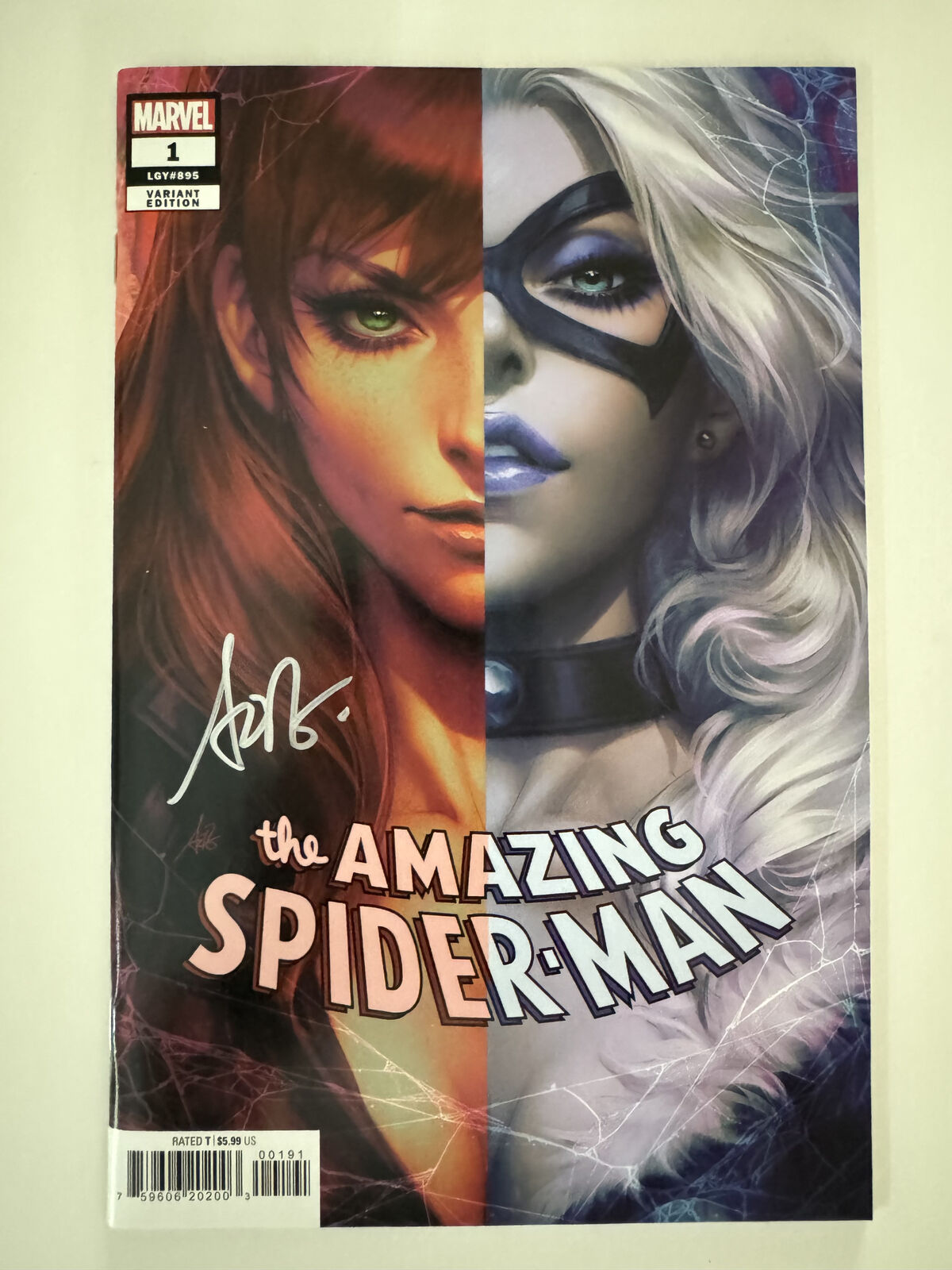 Cover of Amazing Spider-Man Comic Book #1 LGY #895 (2022), signed by Stanley "Artgerm" Lau.