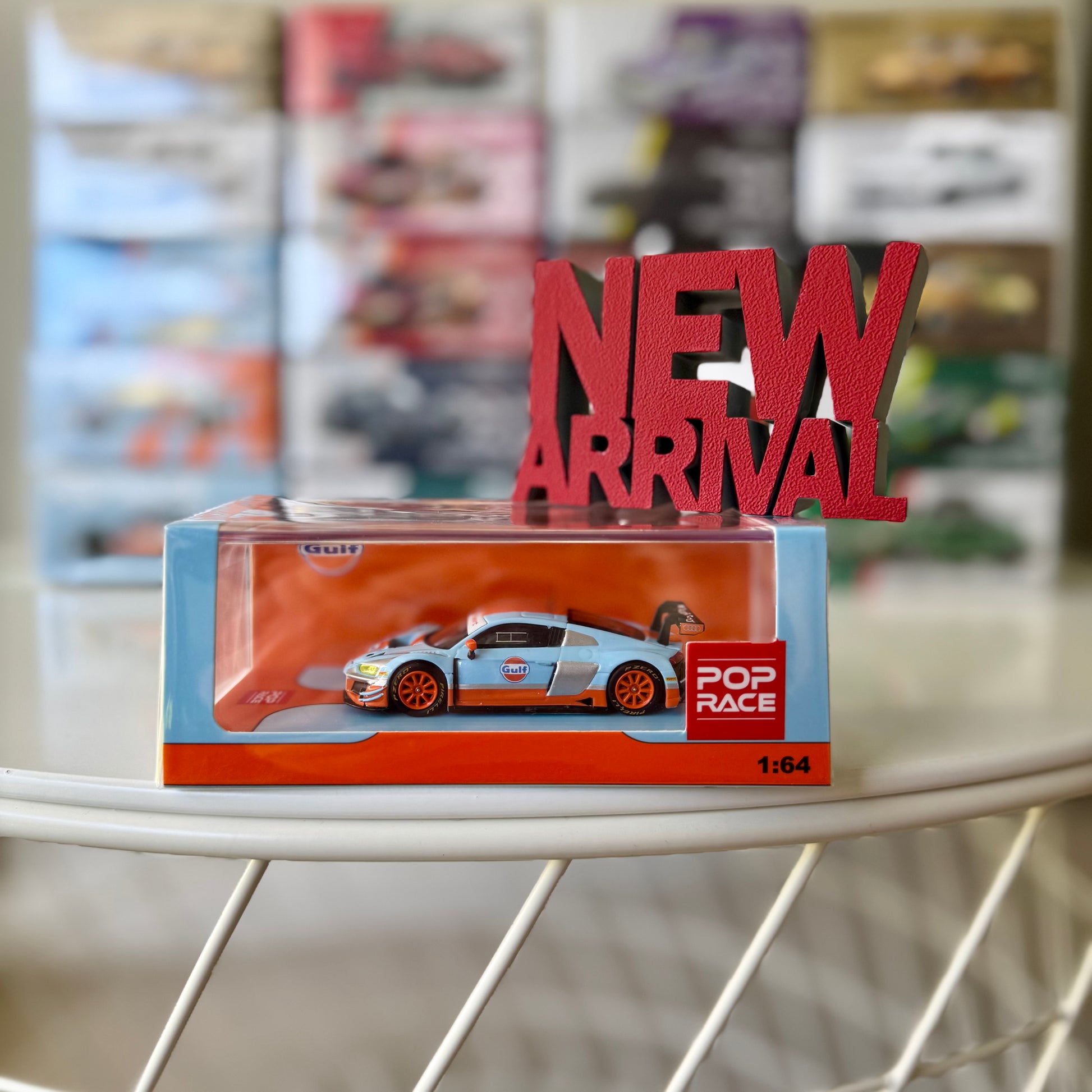 Front view of Audi R8 LMS Gulf Livery diecast model by Pop Race with New Arrival sign