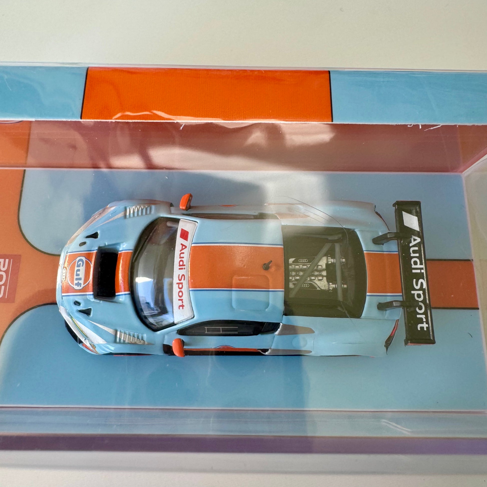 Top-down view of 1:64 scale Audi R8 LMS Gulf edition