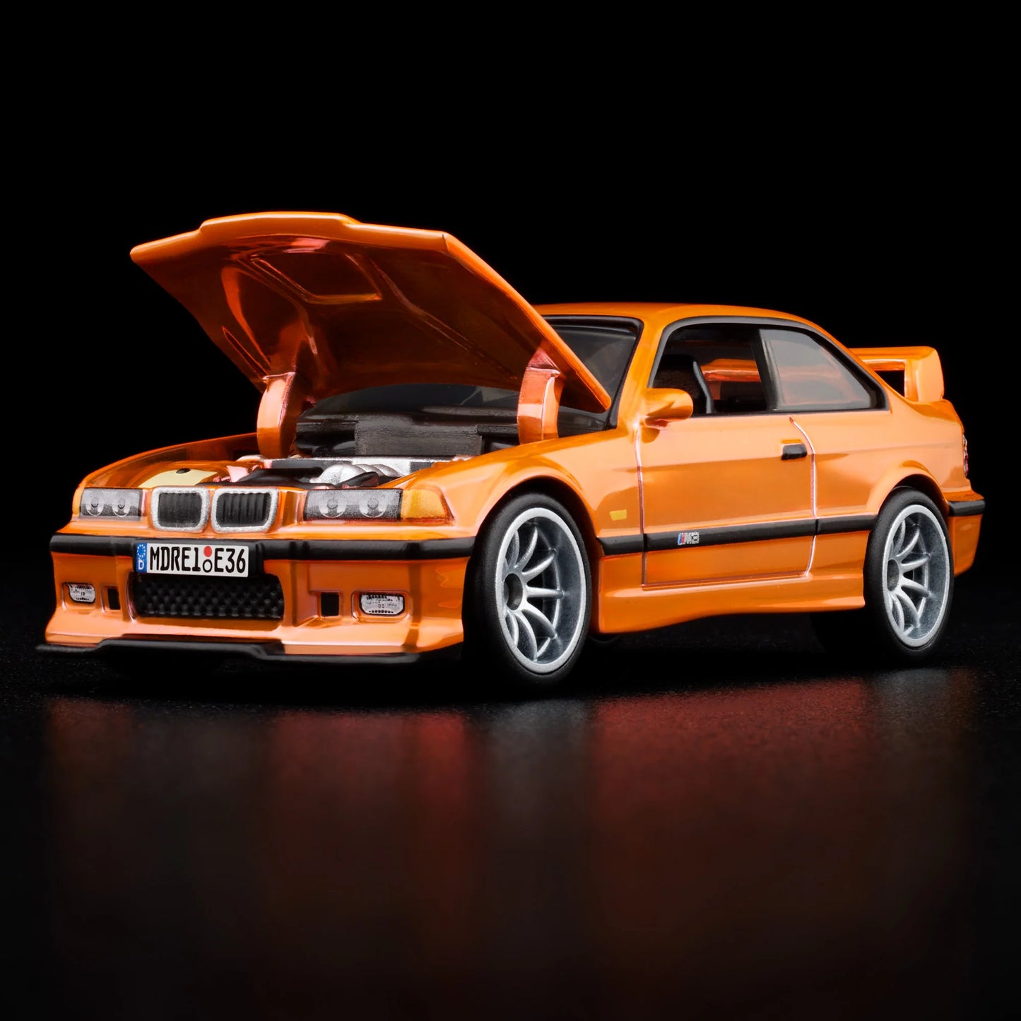 Side profile of Hot Wheels Collectors 1:64 BMW M3 LTW in orange