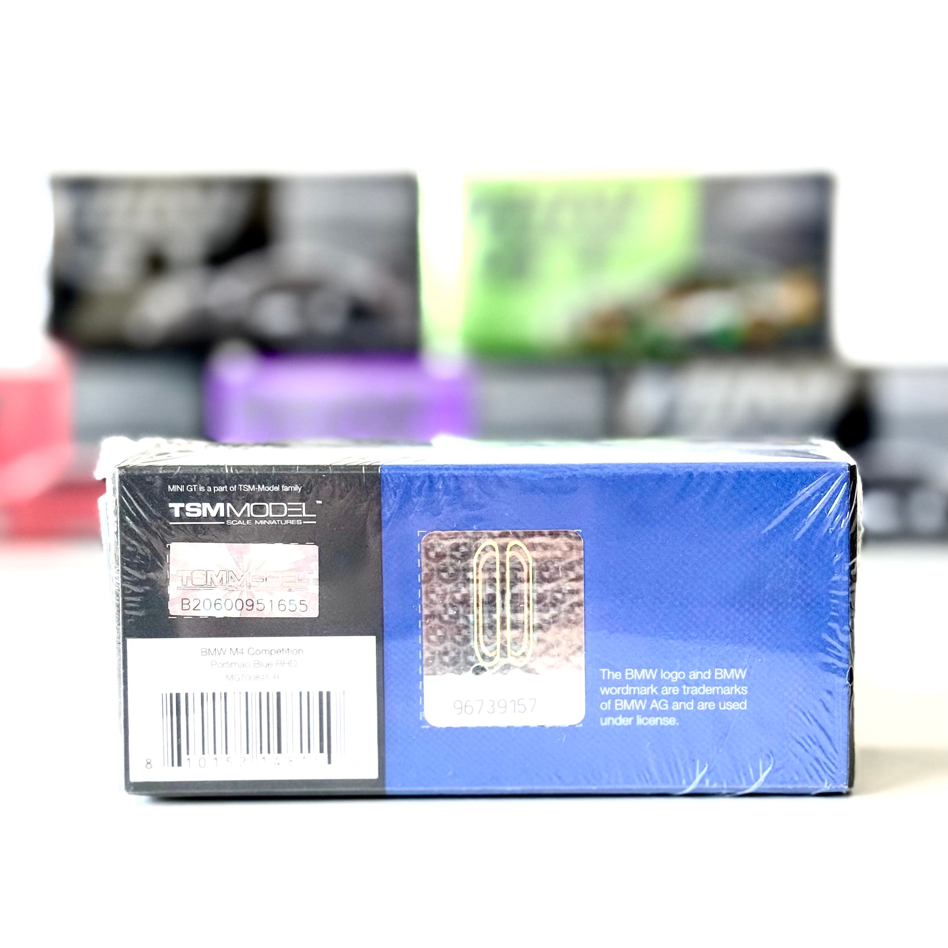 Rear view of BMW M4 Competition 1:64 box by Mini GT