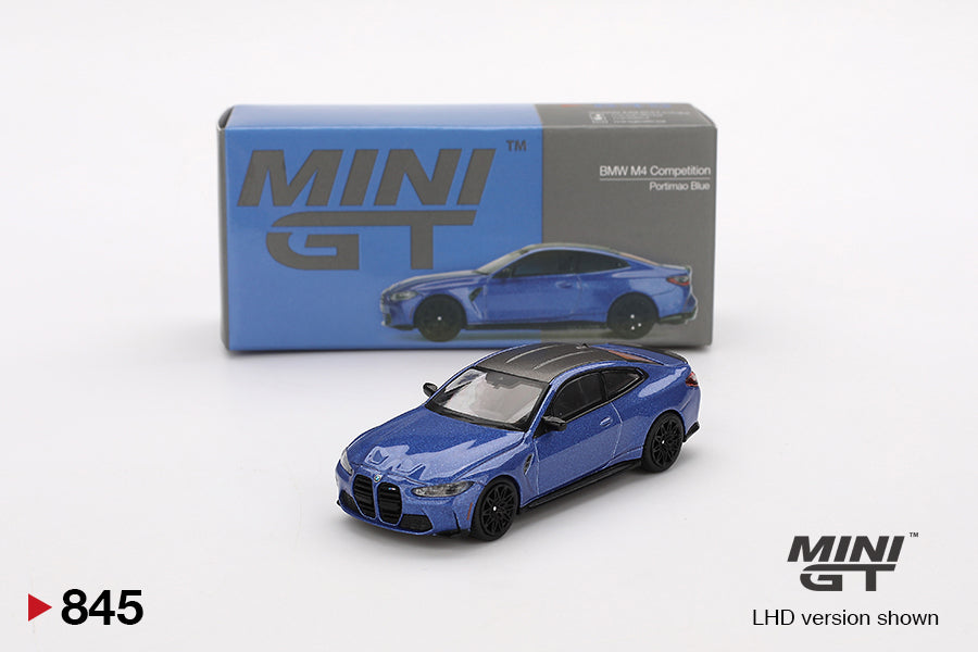 Front of boxed BMW M4 Competition Portimao Blue RHD 1:64 model by Mini GT