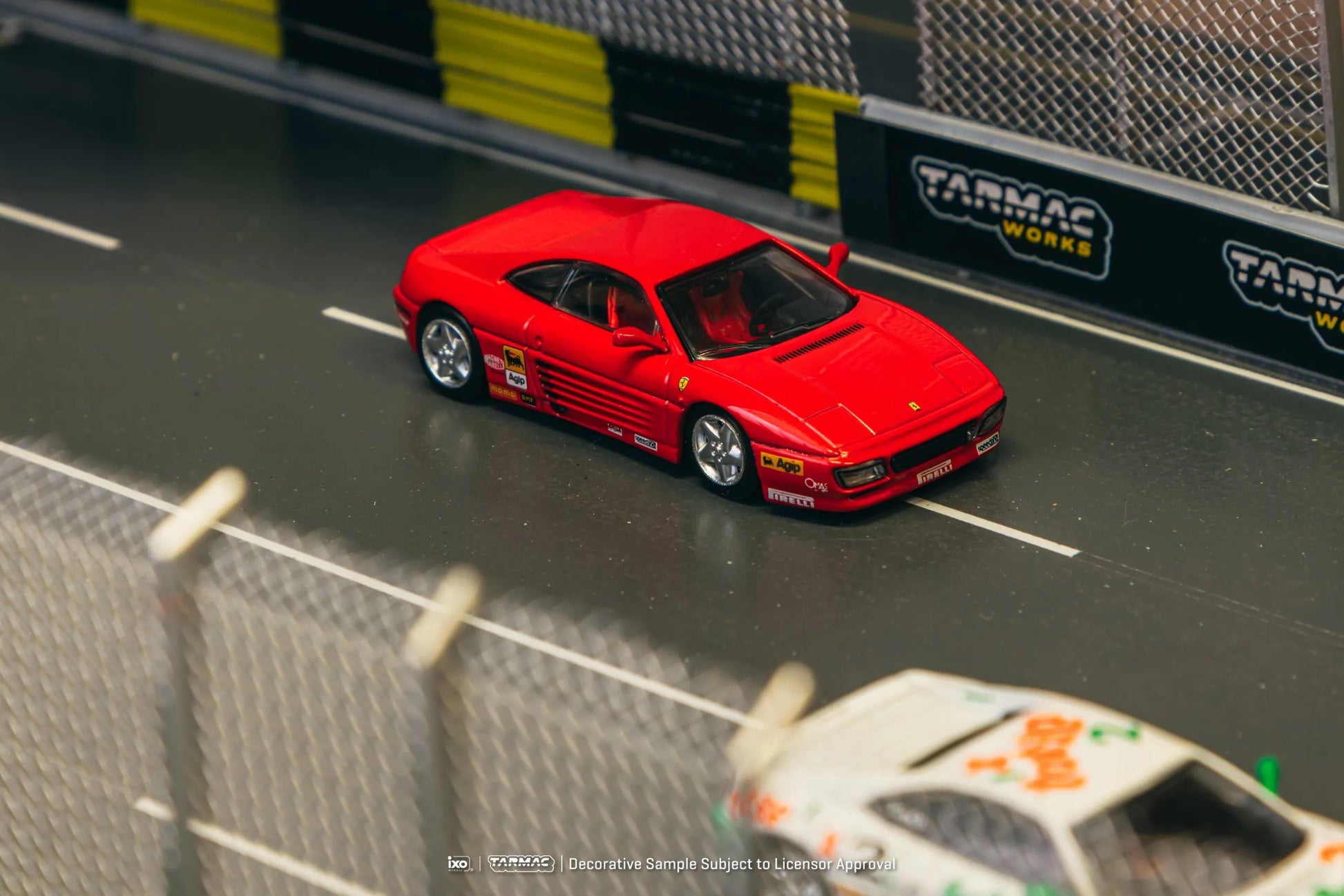 Ferrari 348 Challenge Presentation model car in a racetrack diorama scene