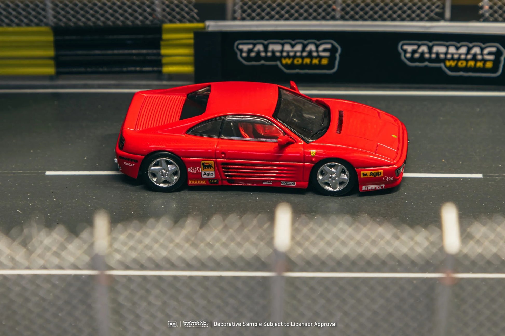 Ferrari 348 Challenge Presentation model car in a racetrack diorama scene