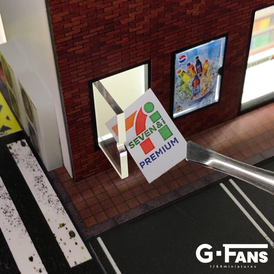 Close-up of 7-Eleven signage on miniature storefront