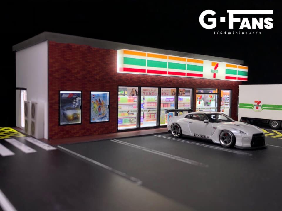 Side view of miniature 7-Eleven with parking lot