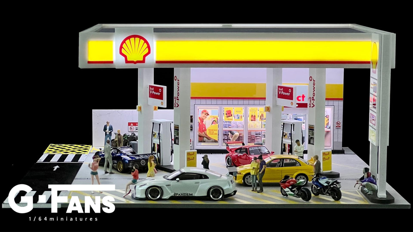 Miniature refueling scene at Shell Station with 1:64 scale cars