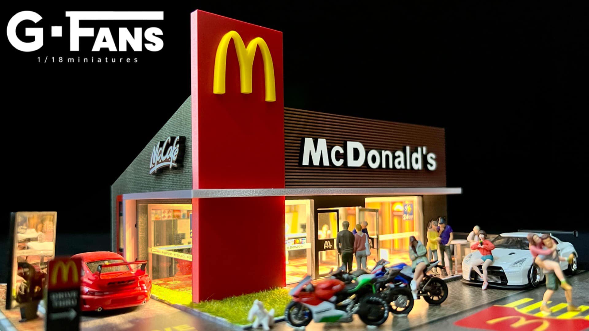 Close-up of golden arches logo on G-Fans McDonald’s model display