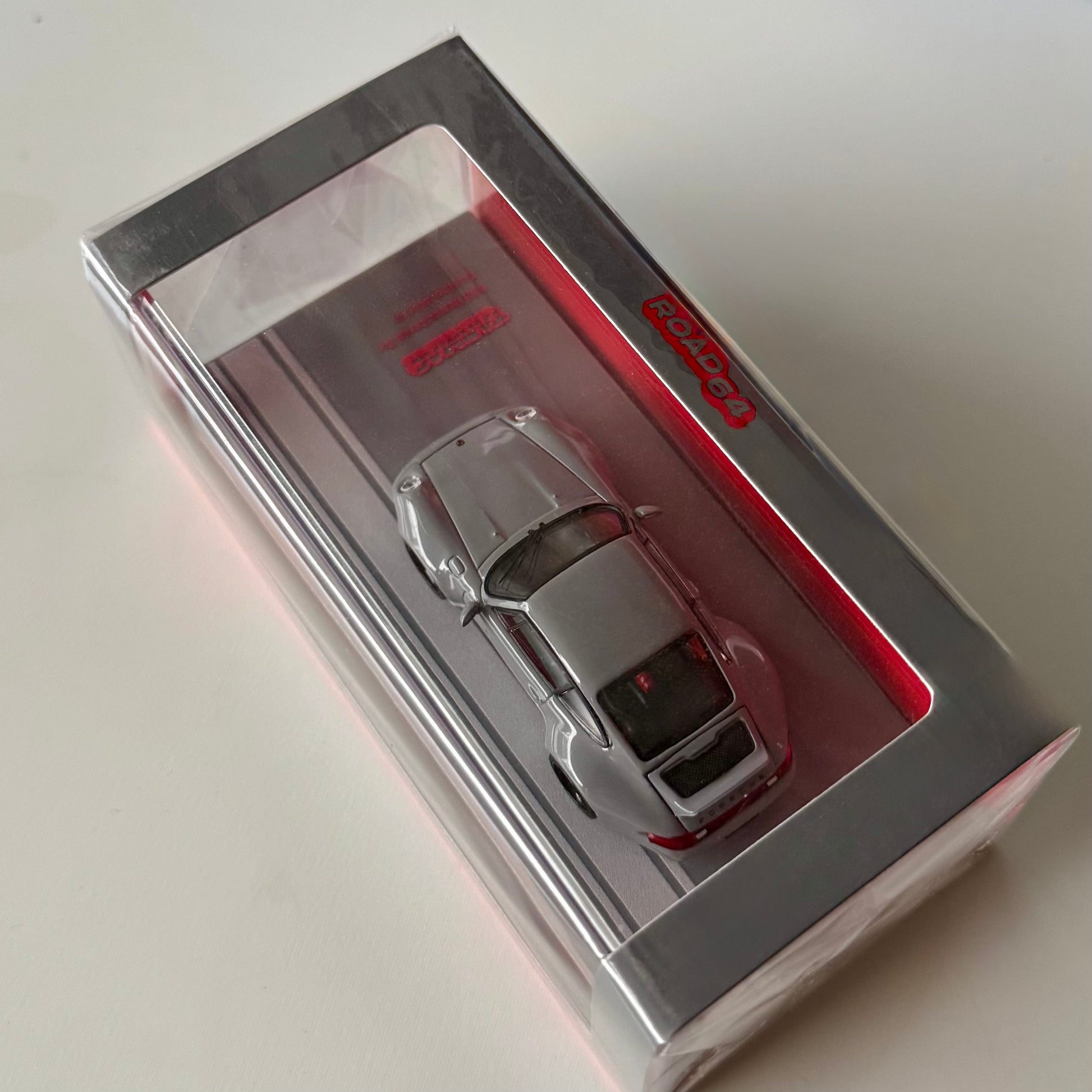 Top packaging shot of 1:64 Porsche 993 Remastered by Gunther Werks in grey