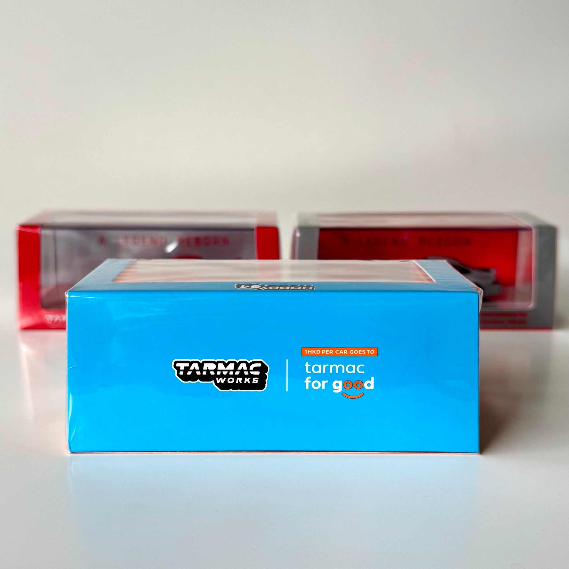 Side view of boxed Gunther Werks Porsche 993 Blue & Orange 1:64 scale model