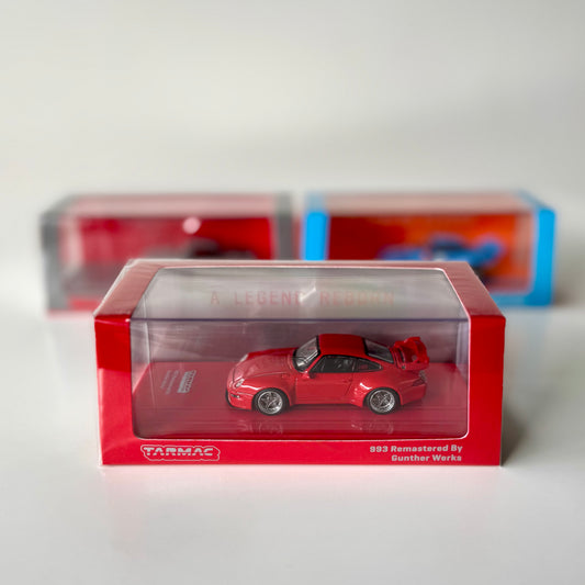 Porsche 993 Remastered by Gunther Werks Red 1:64 in acrylic box – front view