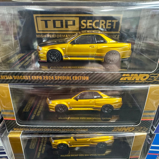 Stack of Nissan Skyline GT-R R34 Top Secret 1:64 diecast model in box front view