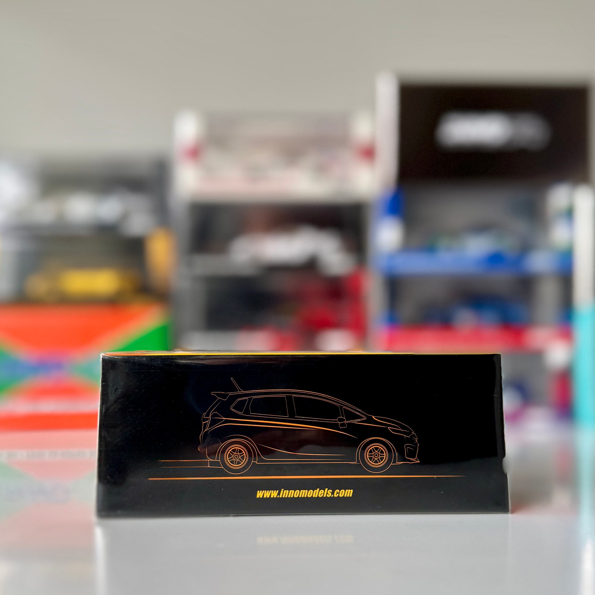 Side profile of INNO64 Honda Fit #99 J’S Racing from Super Taikyu 2014