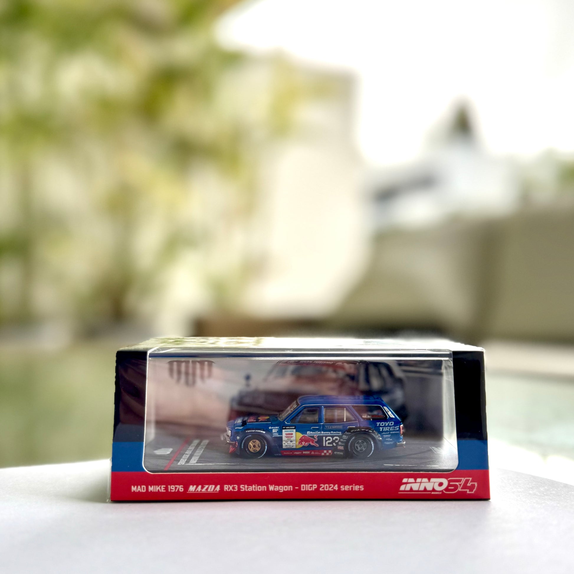 Front panorama view of INNO64 Mazda RX-3 Wagon Mad Mike D1GP 2024 diecast model
