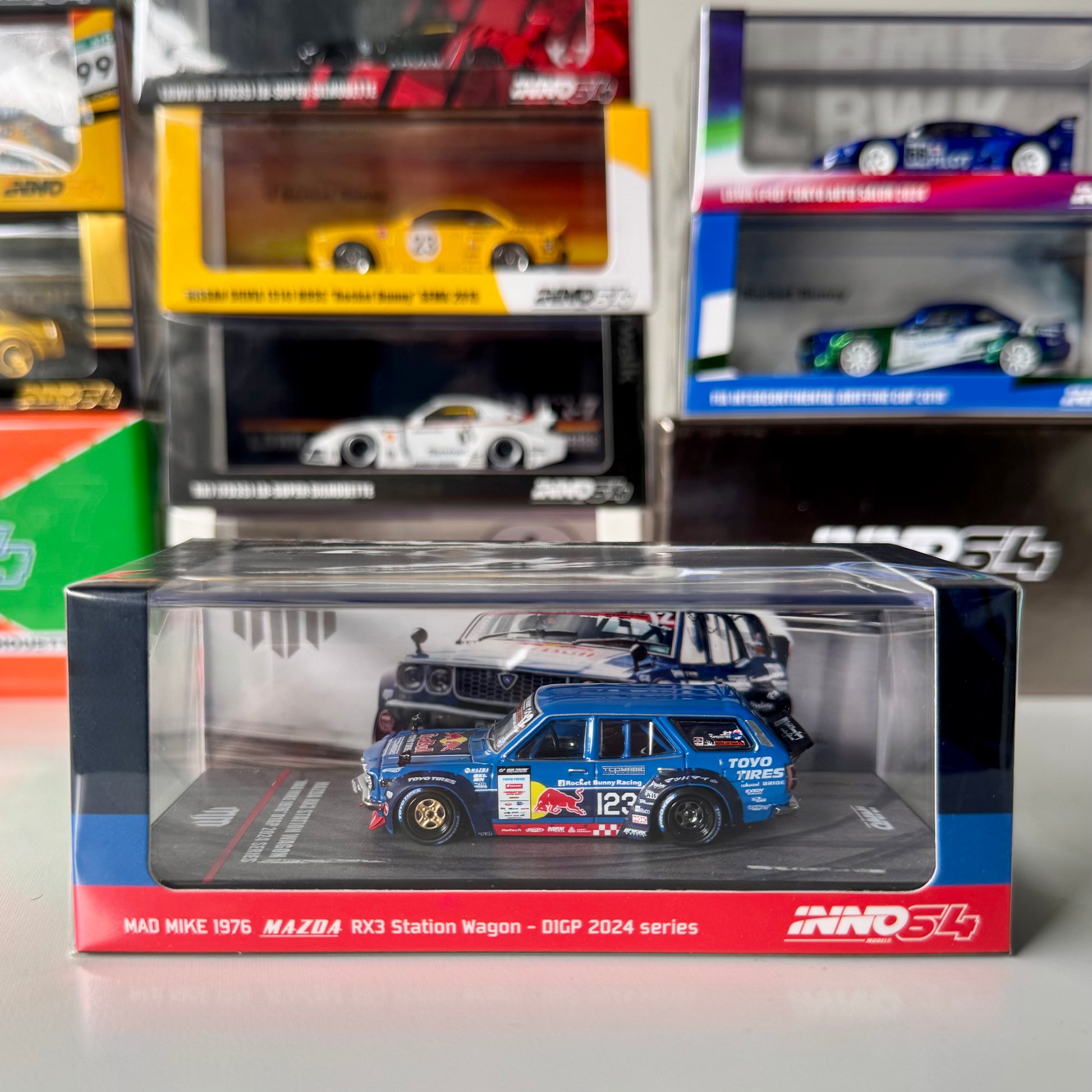 Front view of INNO64 Mazda RX-3 Wagon Mad Mike D1GP 2024 diecast model
