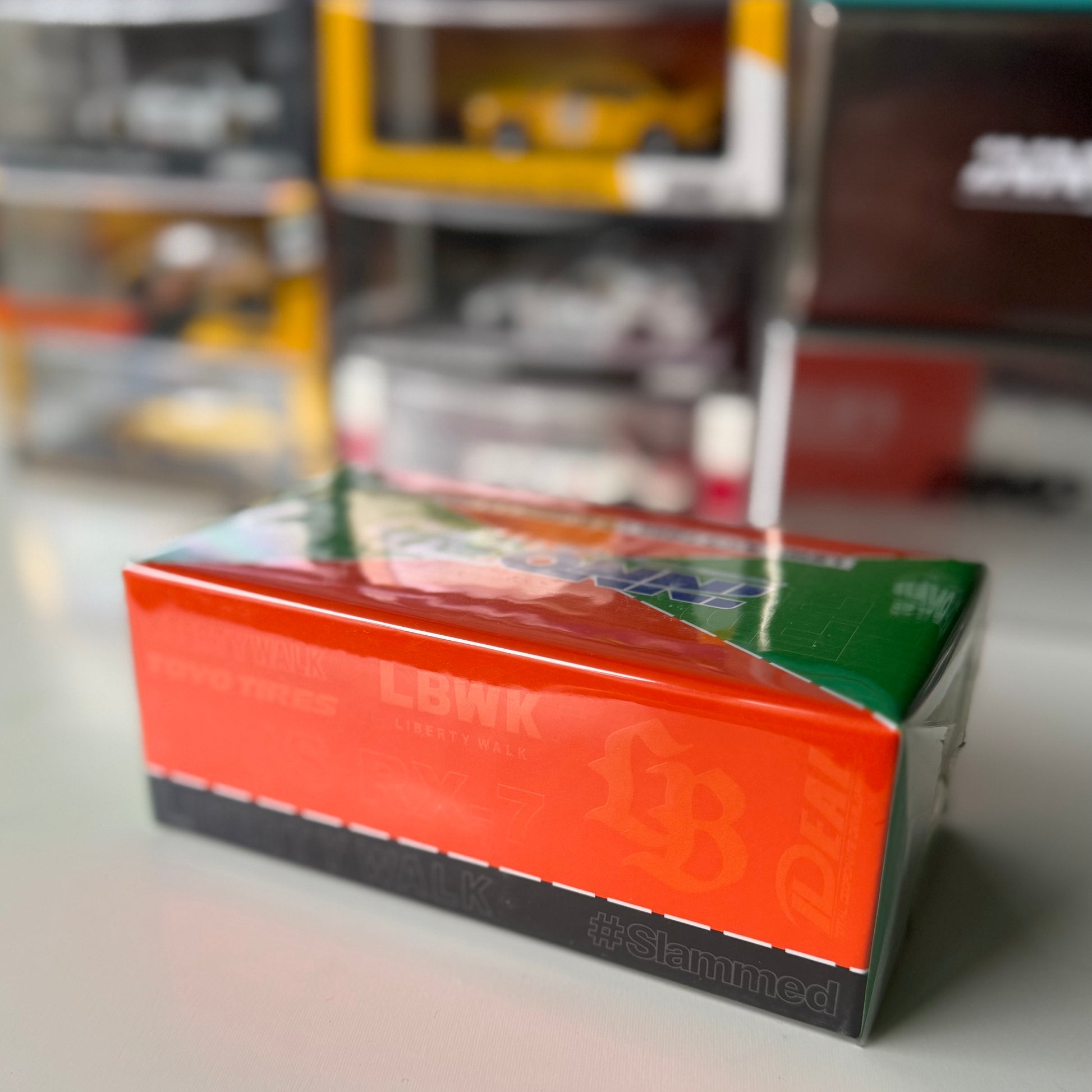 Packaging of INNO64 RX-7 LBWK Orange & Green Malaysia Diecast Expo edition