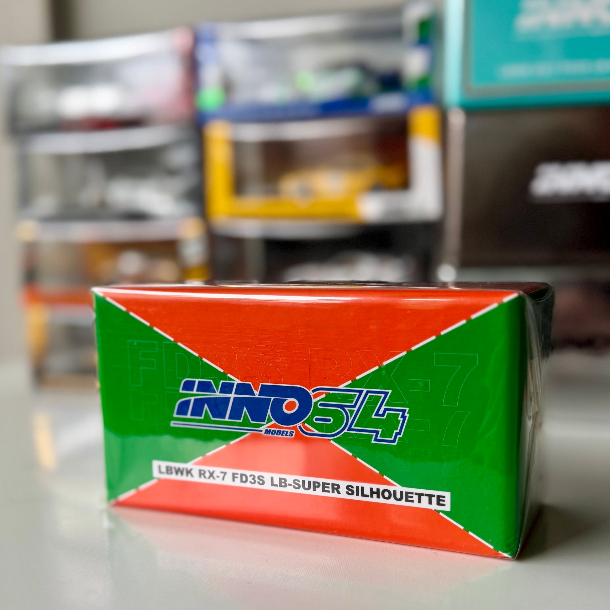 Packaging of INNO64 RX-7 LBWK Orange & Green Malaysia Diecast Expo edition
