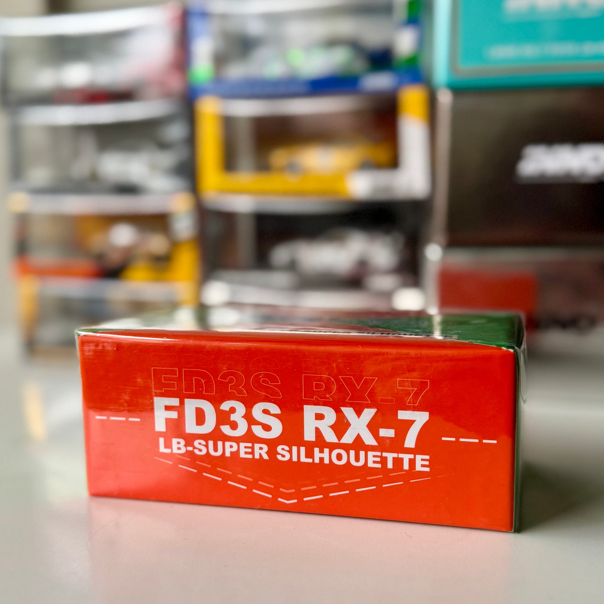 Packaging of INNO64 RX-7 LBWK Orange & Green Malaysia Diecast Expo edition