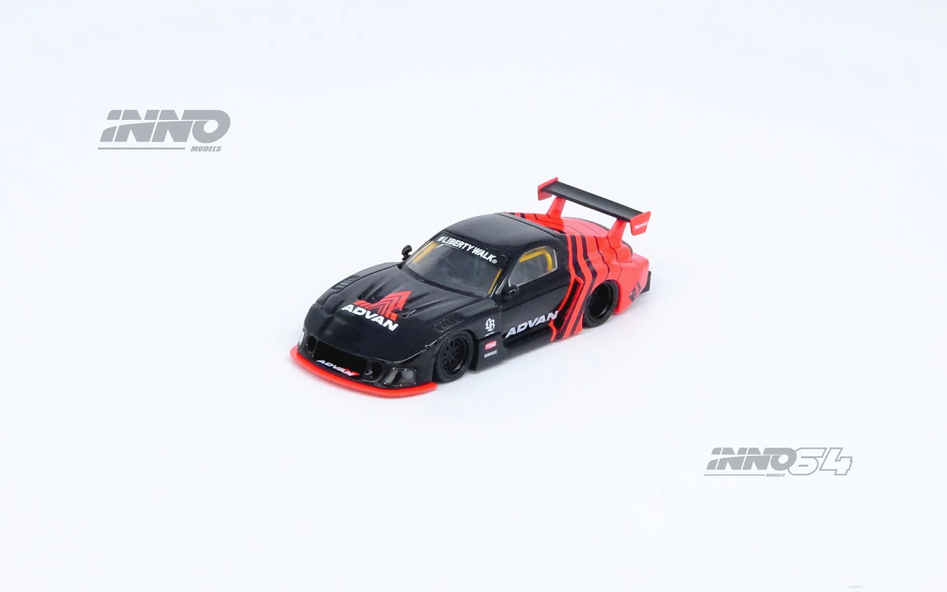 Front view of INNO64 Mazda RX-7 FD3S LBWK Super Silhouette in Advan livery unboxed