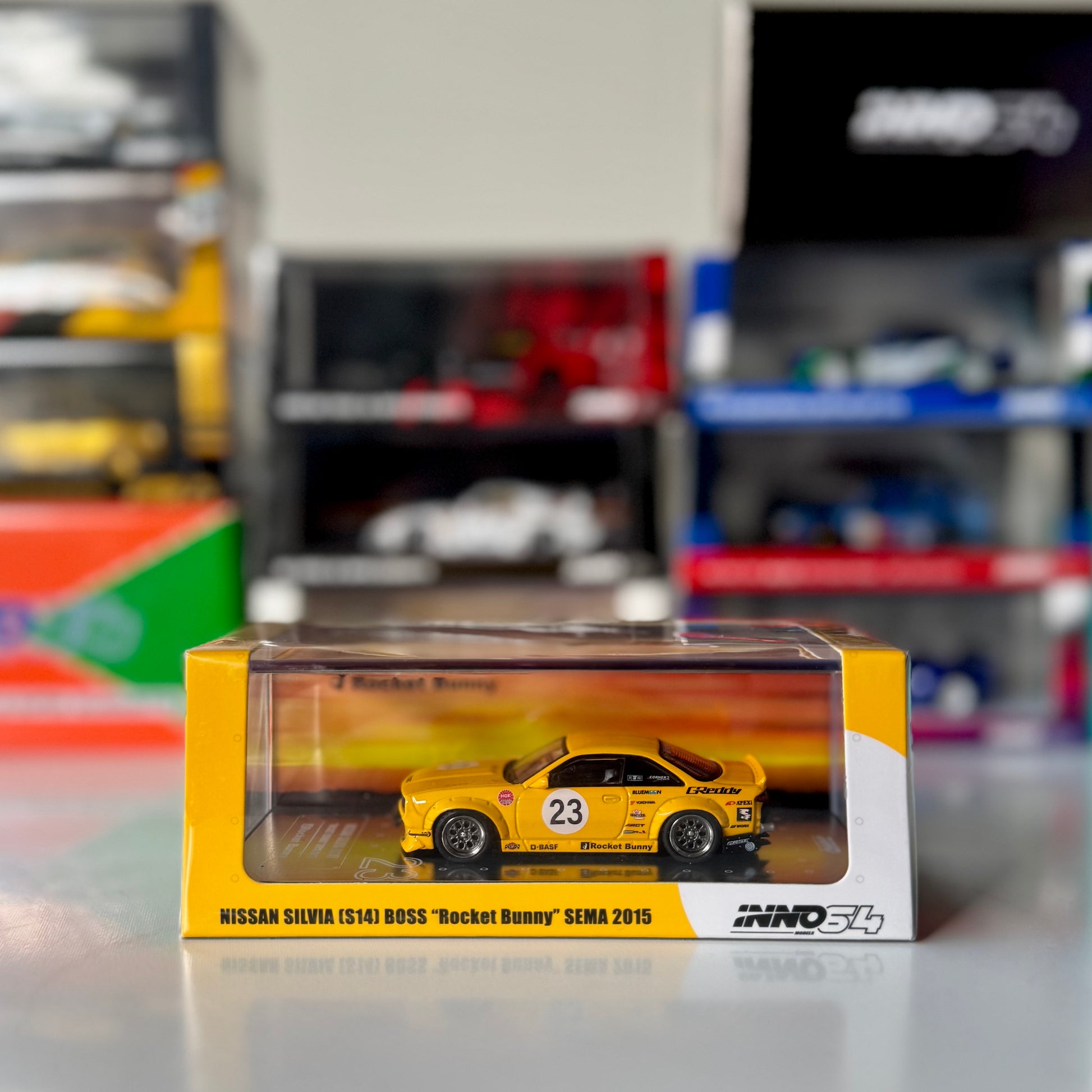 Front view of INNO64 Nissan Silvia S14 BOSS Red Bull livery #15 diecast model