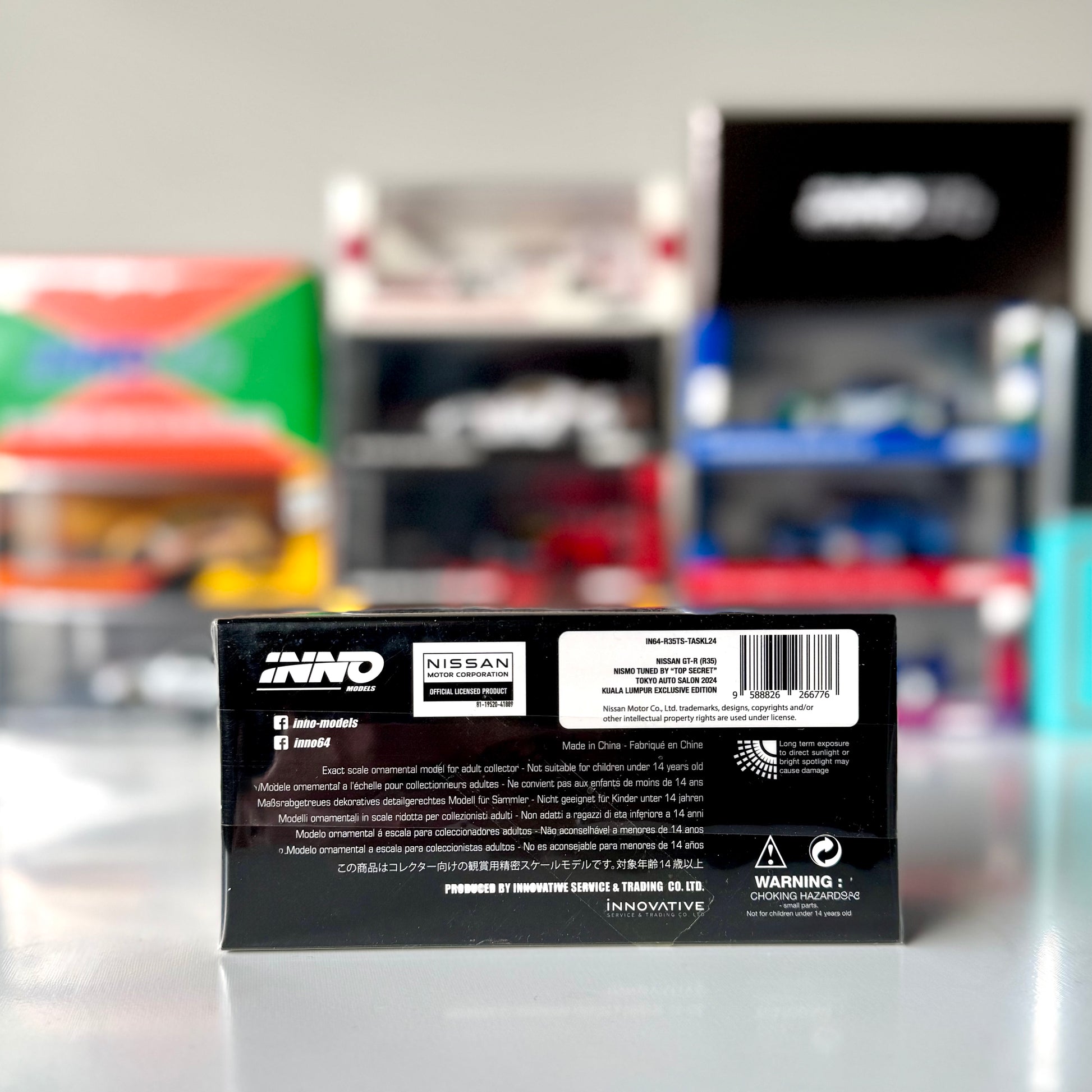 Rear view of INNO64 GT-R R35 Top Secret in gold livery – KL Expo exclusive