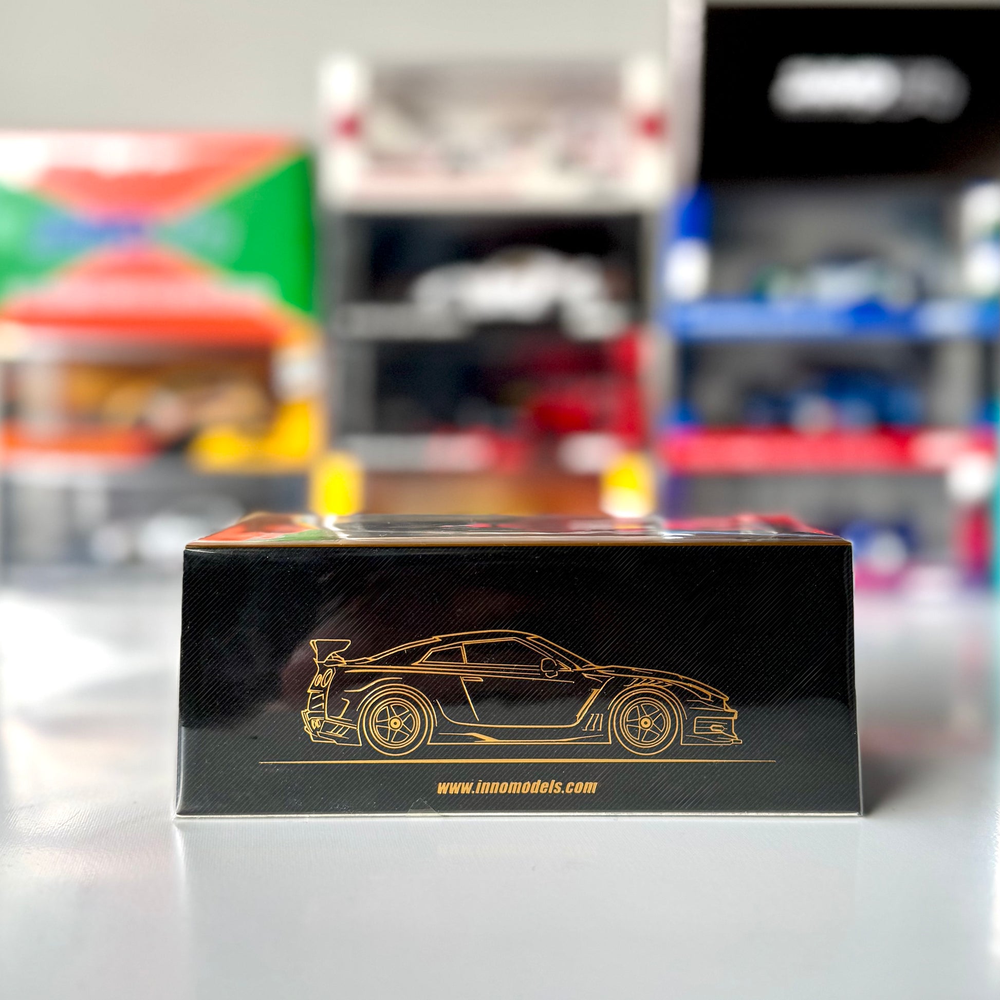 Side profile of Nissan GT-R R35 Top Secret Gold diecast by INNO64