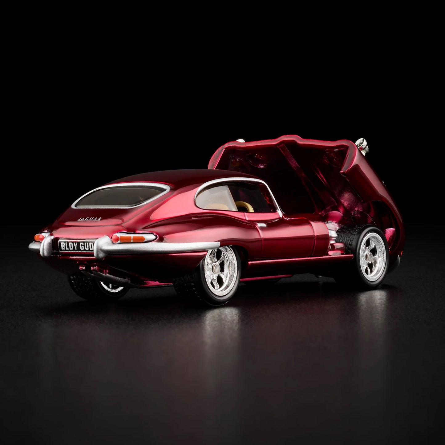 Loose 1964 Jaguar E-Type model with hood open showing detailed engine