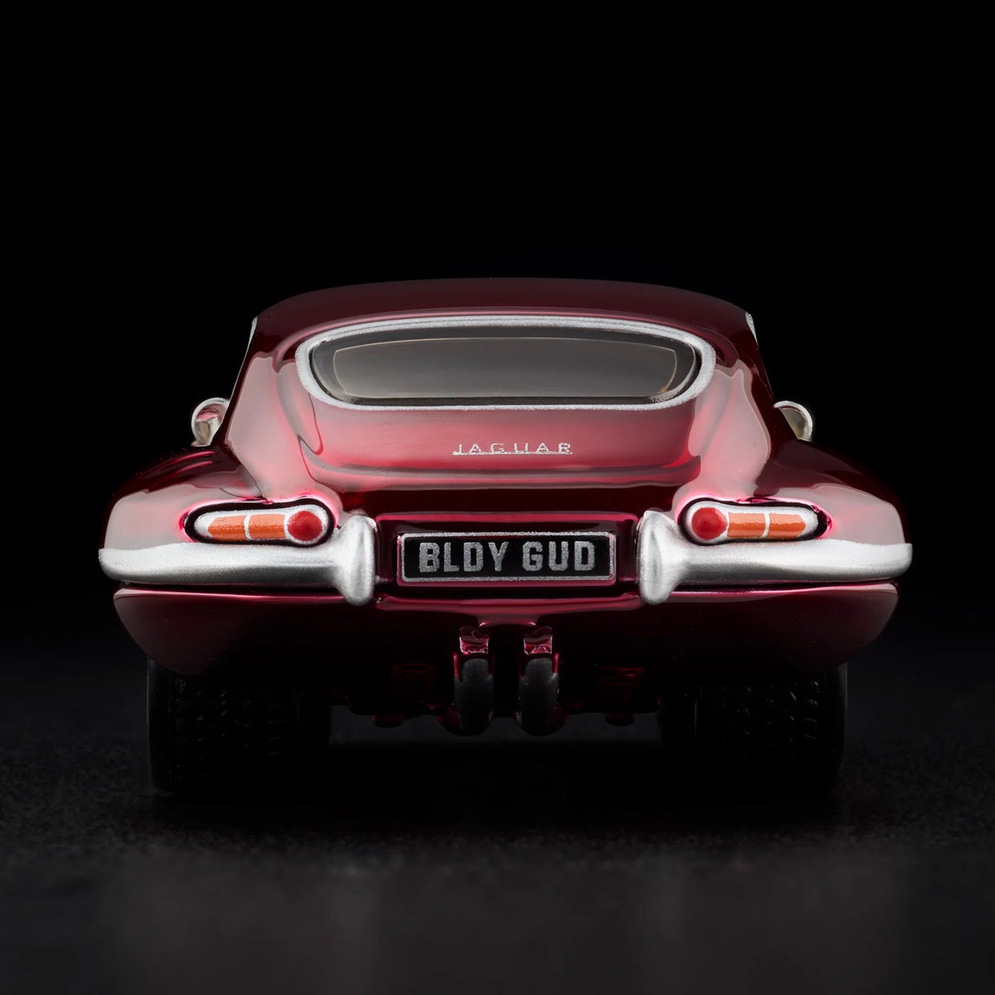 Rear view of loose Jaguar E-Type diecast model showing taillight and bumper details