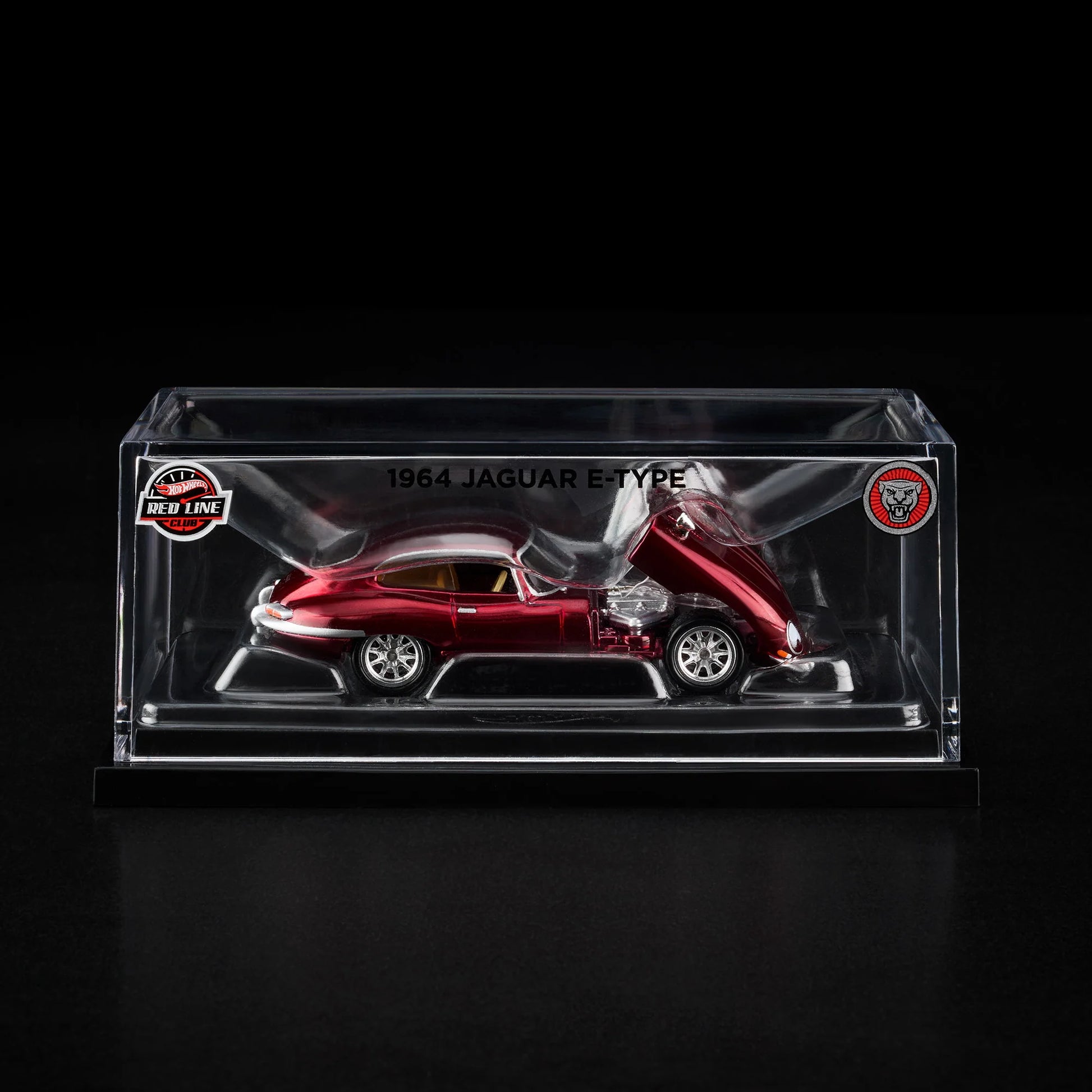 Side view of Hot Wheels RLC 1964 Jaguar E-Type in acrylic case with slipcover