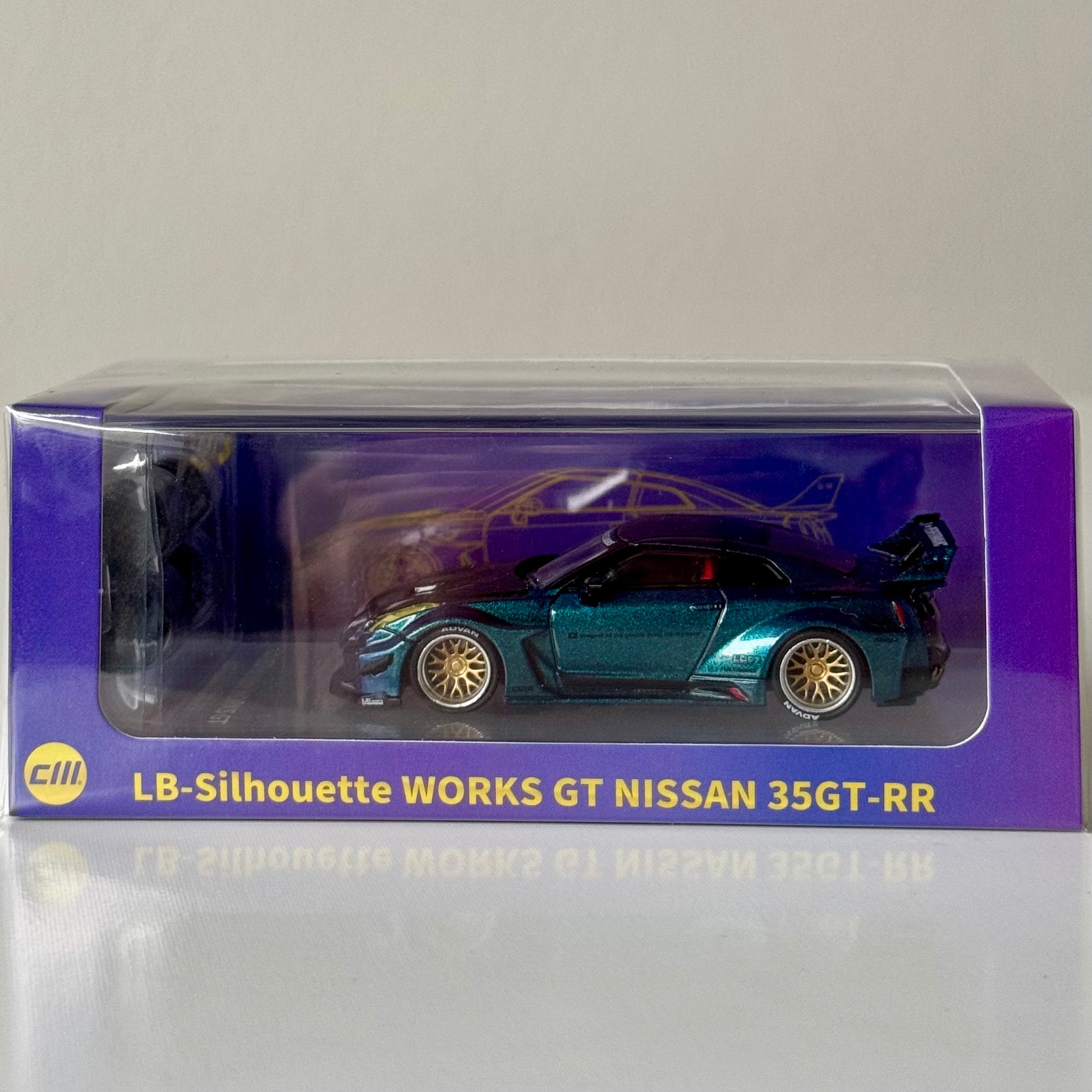 Nissan LBWK 35GT‑RR Chameleon with Carbon diecast in display base – front view