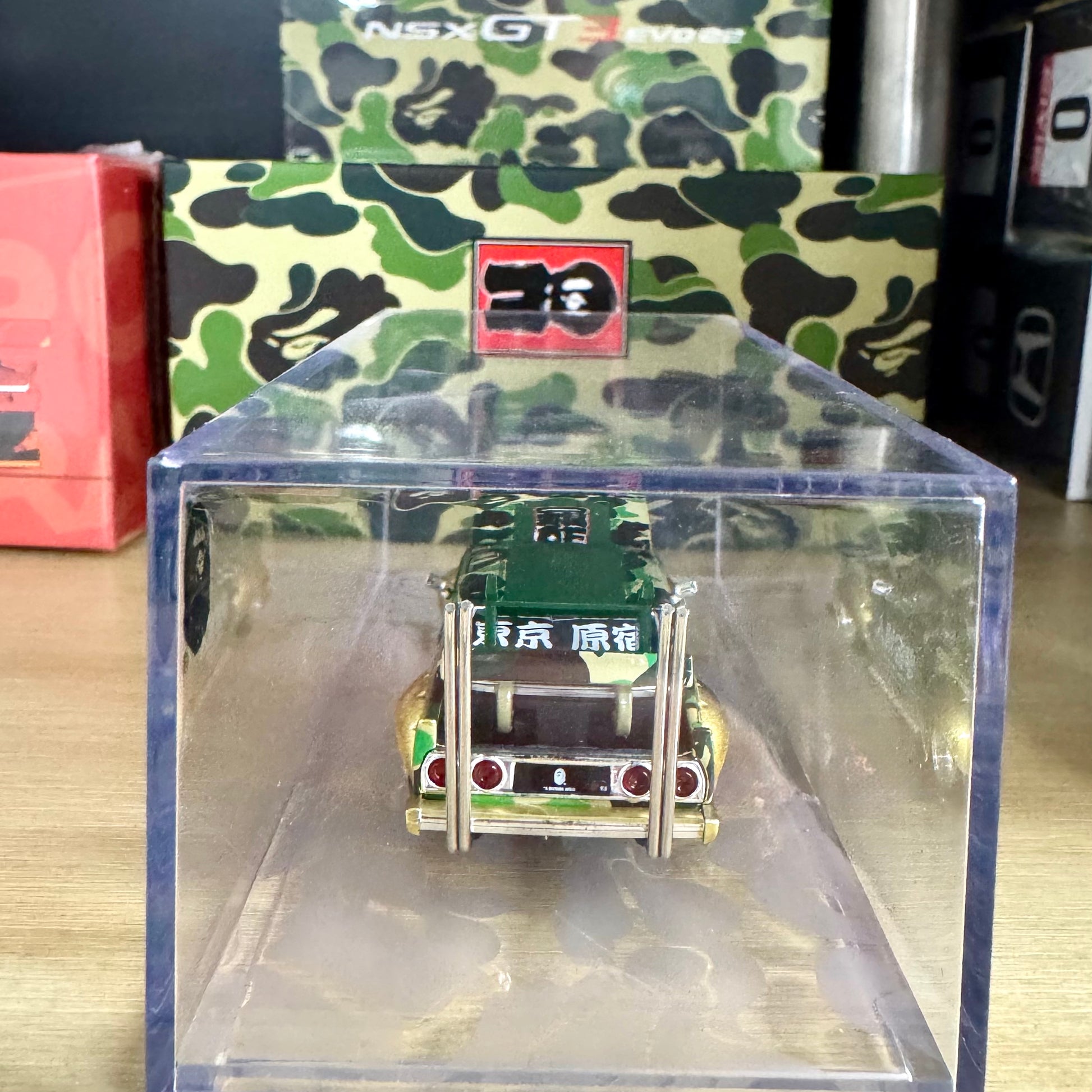 Low rear angle showing details of BAPE Kaido Racer Nissan in display case