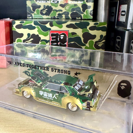 Side view of BAPE Kaido Racer Skyline diecast in clear acrylic display box