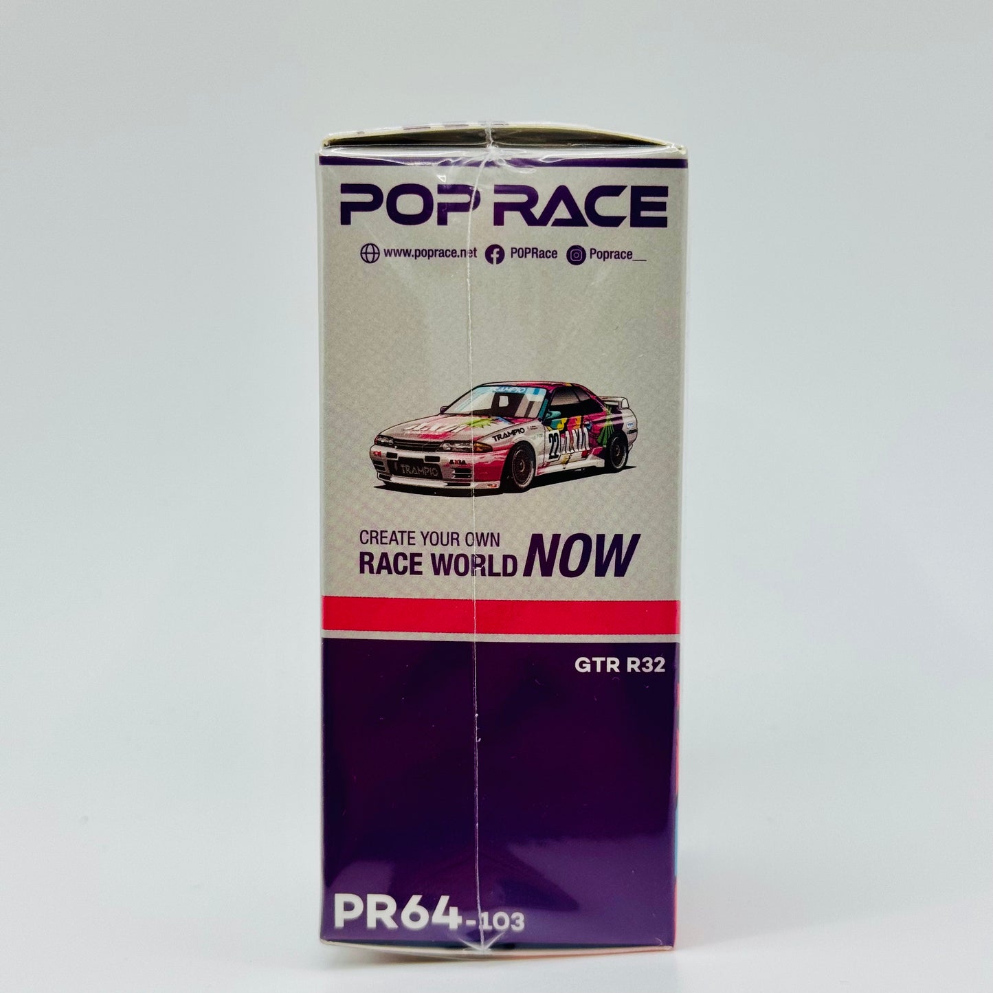Side profile of Pop Race Nissan Skyline GT-R R32 #22 AXIA Group A model in box