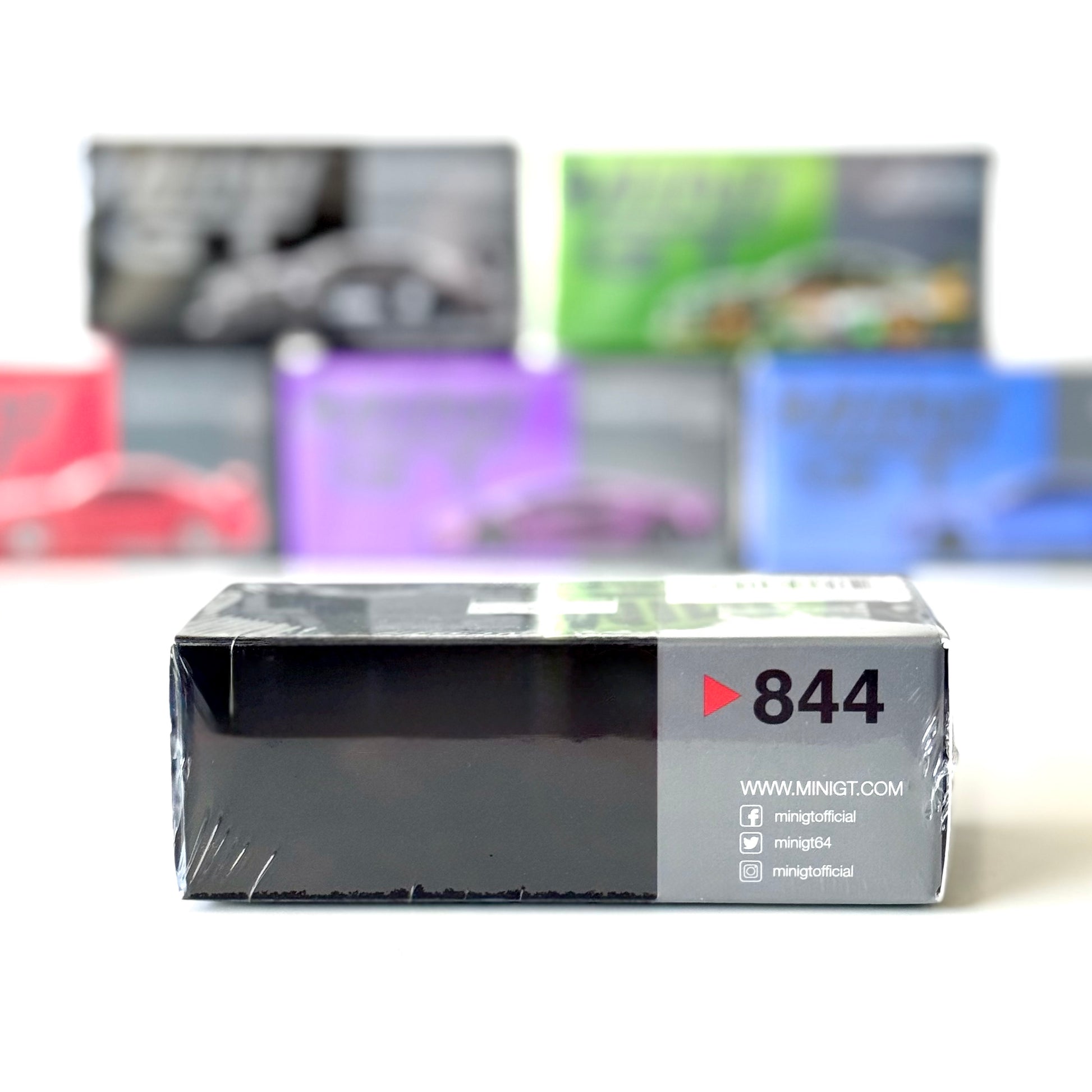 Side view of packaging for Mini GT LB-ER34 Skyline Super Silhouette Black RHD