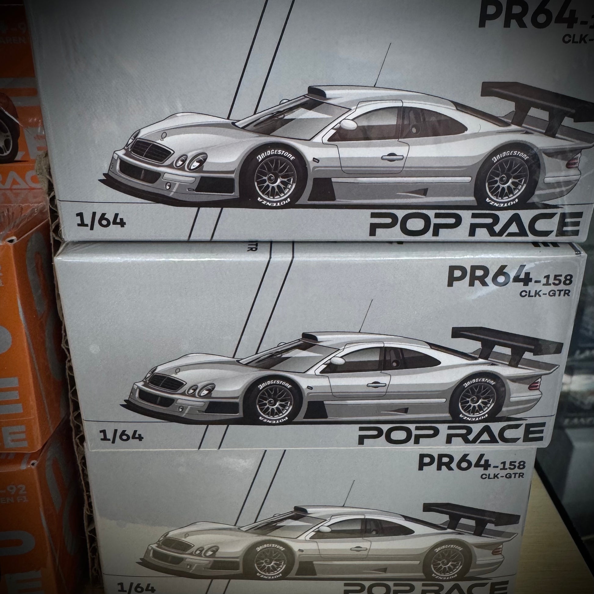 Front of standard Pop Race stacked boxes Mercedes-Benz AMG CLK GTR 1:64 diecast models