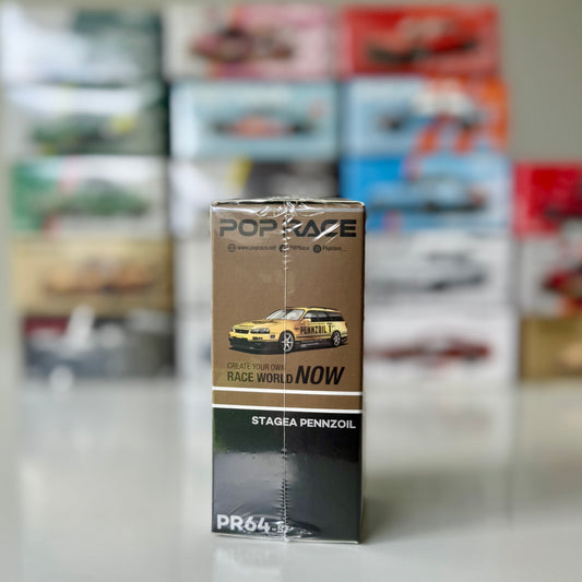 Side view of Nissan Stagea R34 diecast car in gold chrome finish by Pop Race