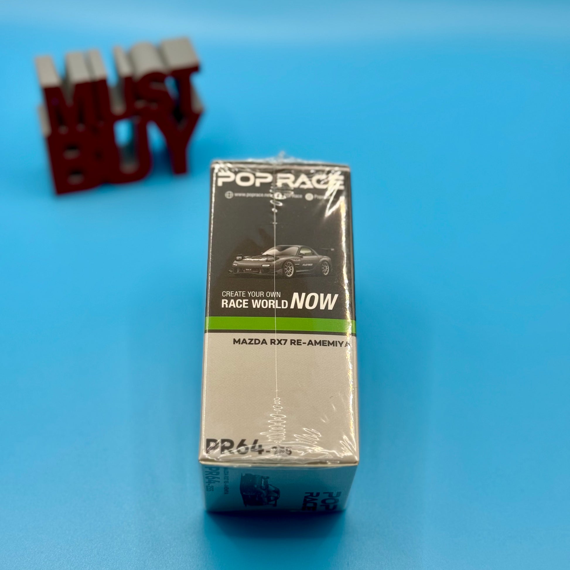 Side angle of box packaging for RX-7 RE-AMEMIYA by Pop Race