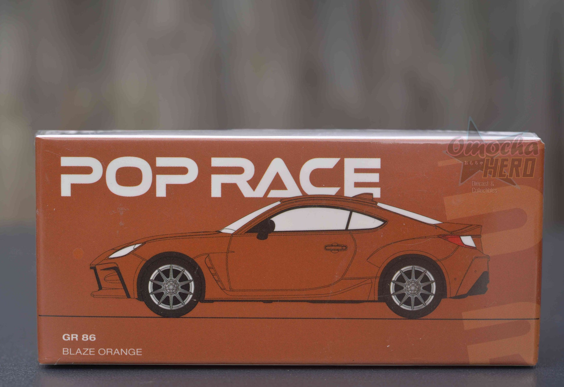 Pop Race Toyota GR86 10th Anniversary Orange 1:64 diecast model – Front of box