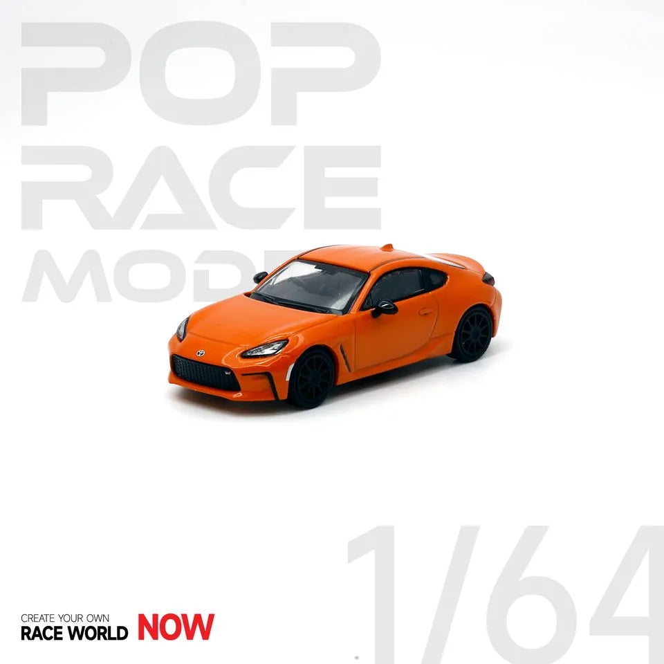 Toyota GR86 10th Anniversary Orange 1:64 diecast – Front angle on display