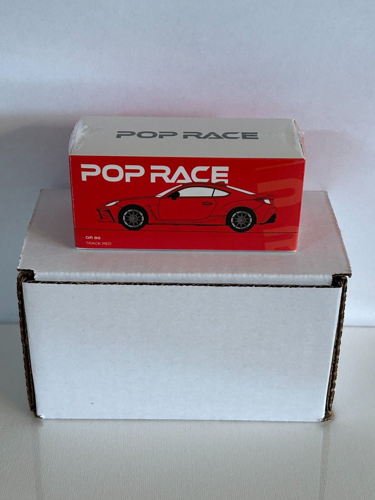 Pop Race Toyota GR86 2022 Track Red 1:64 diecast model car – Front box view