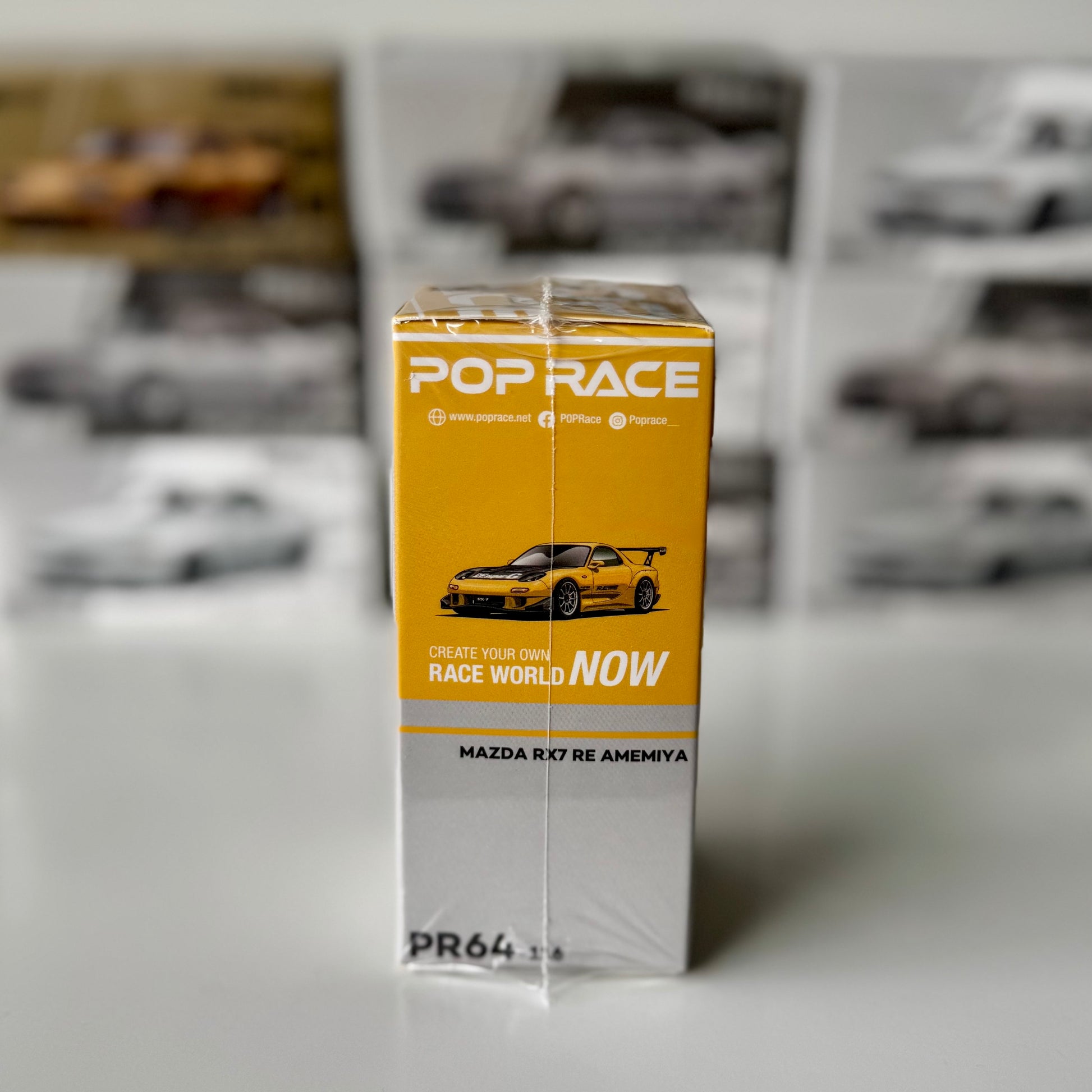 Side view of RX-7 FD RE-Amemiya Widebody Yellow in packaging by Pop Race