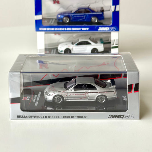 Nissan Skyline GT-R R33 Mine’s Silver 1:64 diecast model in display box – front view