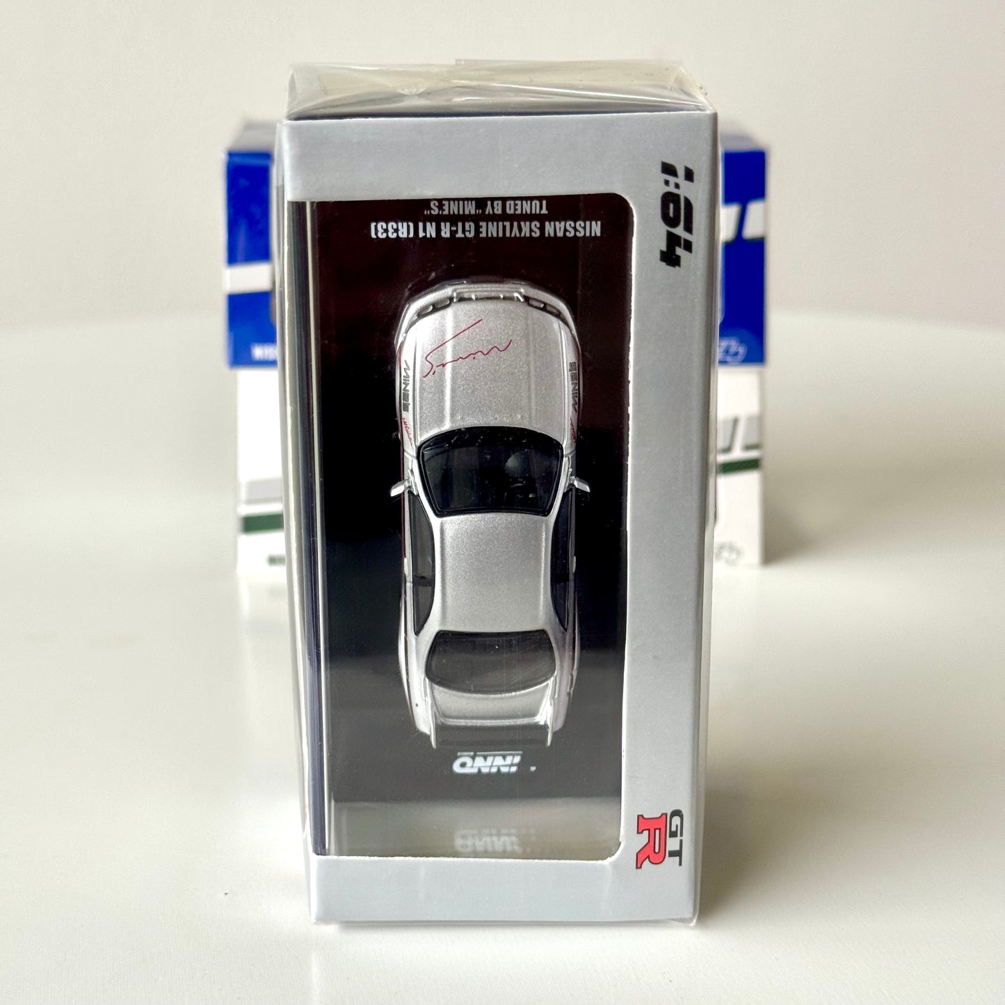 Top view of INNO64 Nissan GT-R R33 Mine’s edition in box