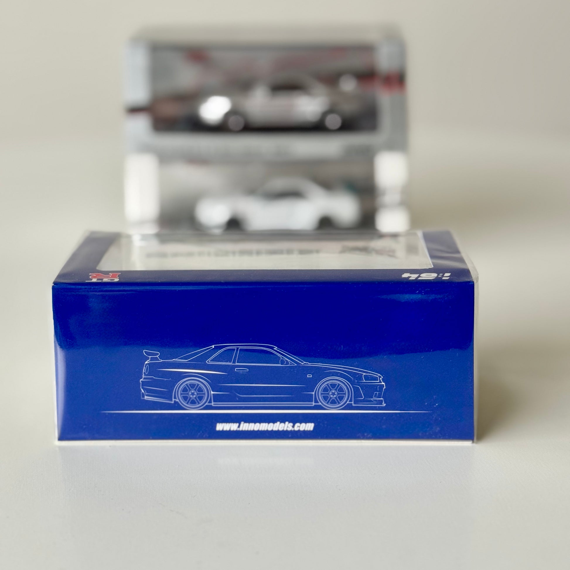 Side packaging of INNO64 Nissan R34 GT-R Mine’s Blue diecast model
