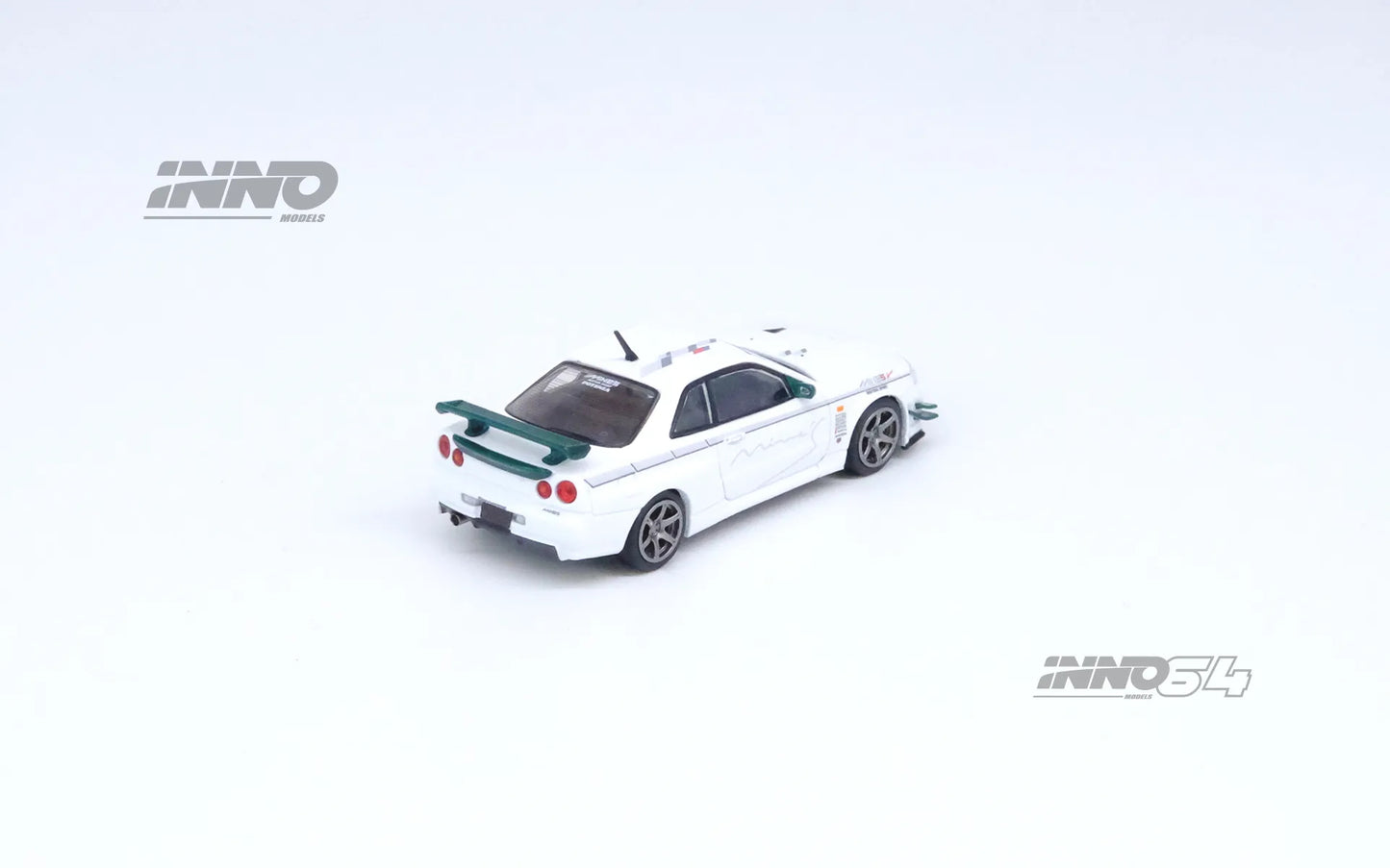 Rear side profile of INNO64 R34 GT-R V-Spec N1 Mine’s White out of box