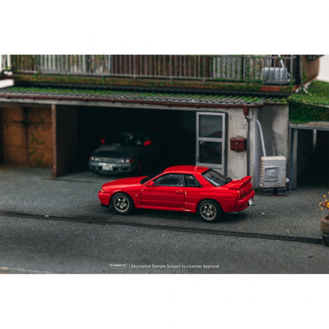 Nissan GT-R BNR32 Red 1:64 scale model in a diorama street scene