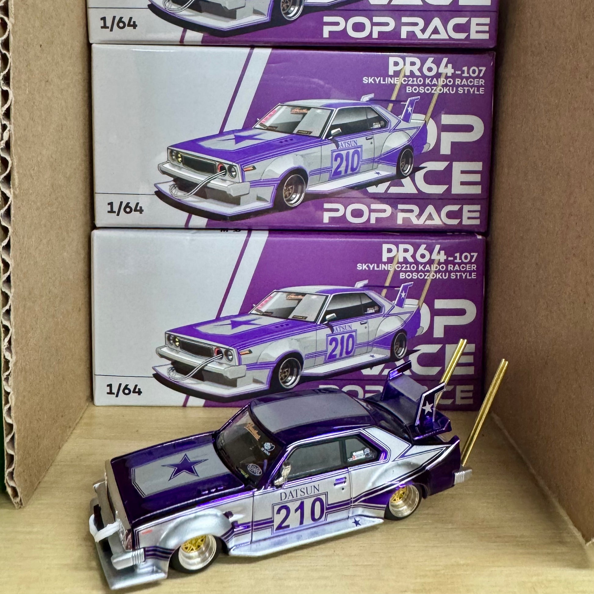 Shelf View from front of Skyline C210 Kaido Racer 1:64 diecast model by Pop Race