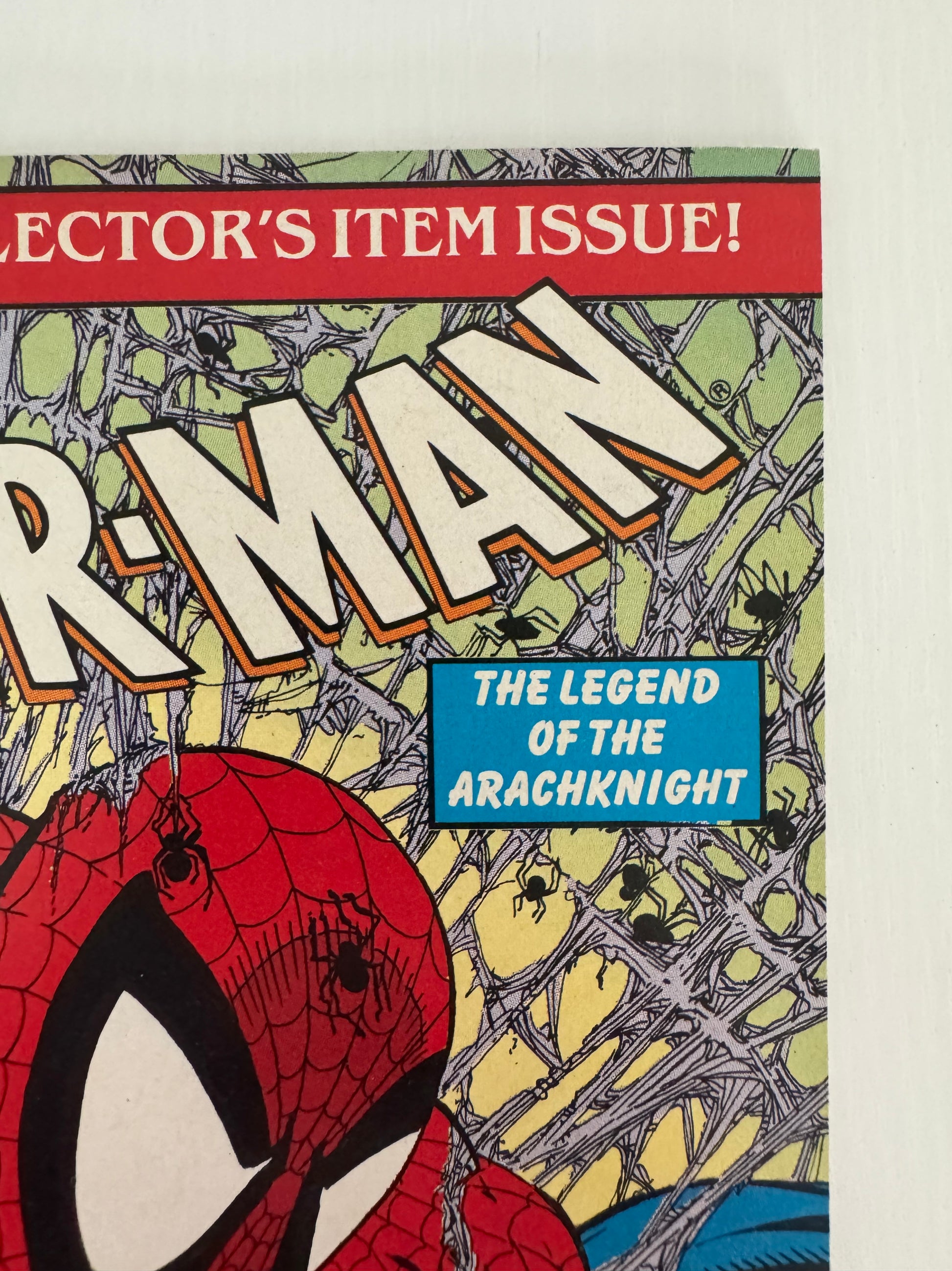 Corner of Spider-Man #1 (1990) comic book laid flat to show the front covers, highlighting overall condition and collectible value.