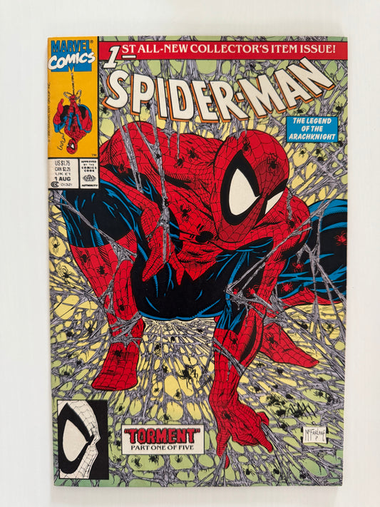 Front cover of Spider-Man #1 (1990), Part 1 of “Torment” storyline, featuring Todd McFarlane’s iconic illustration of Spider-Man crouched in a web-filled background.
