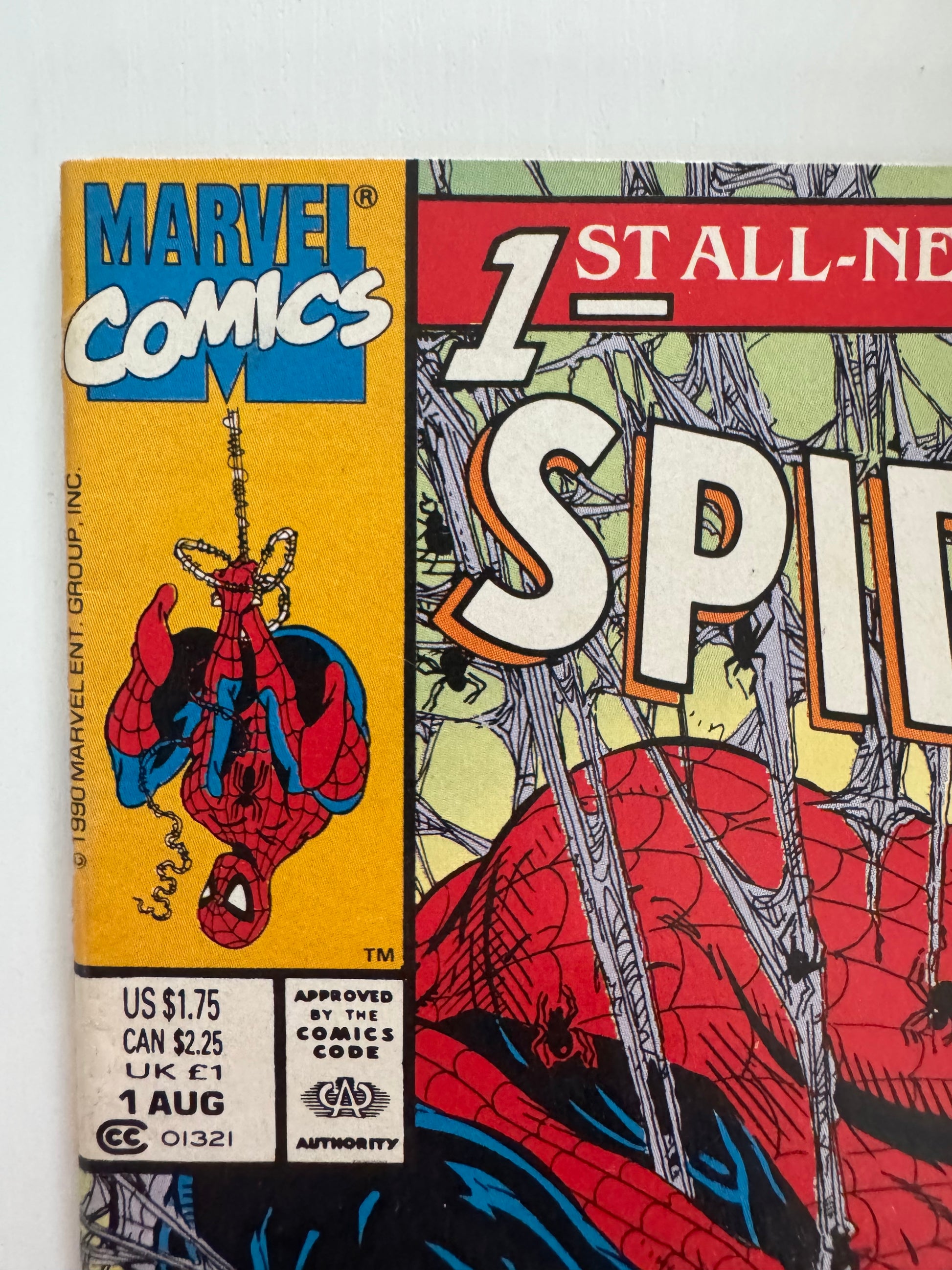 Close-up of the Spider-Man #1 (1990) comic book title and Marvel Comics logo, showcasing the embossed lettering and series title “Torment Part 1”.